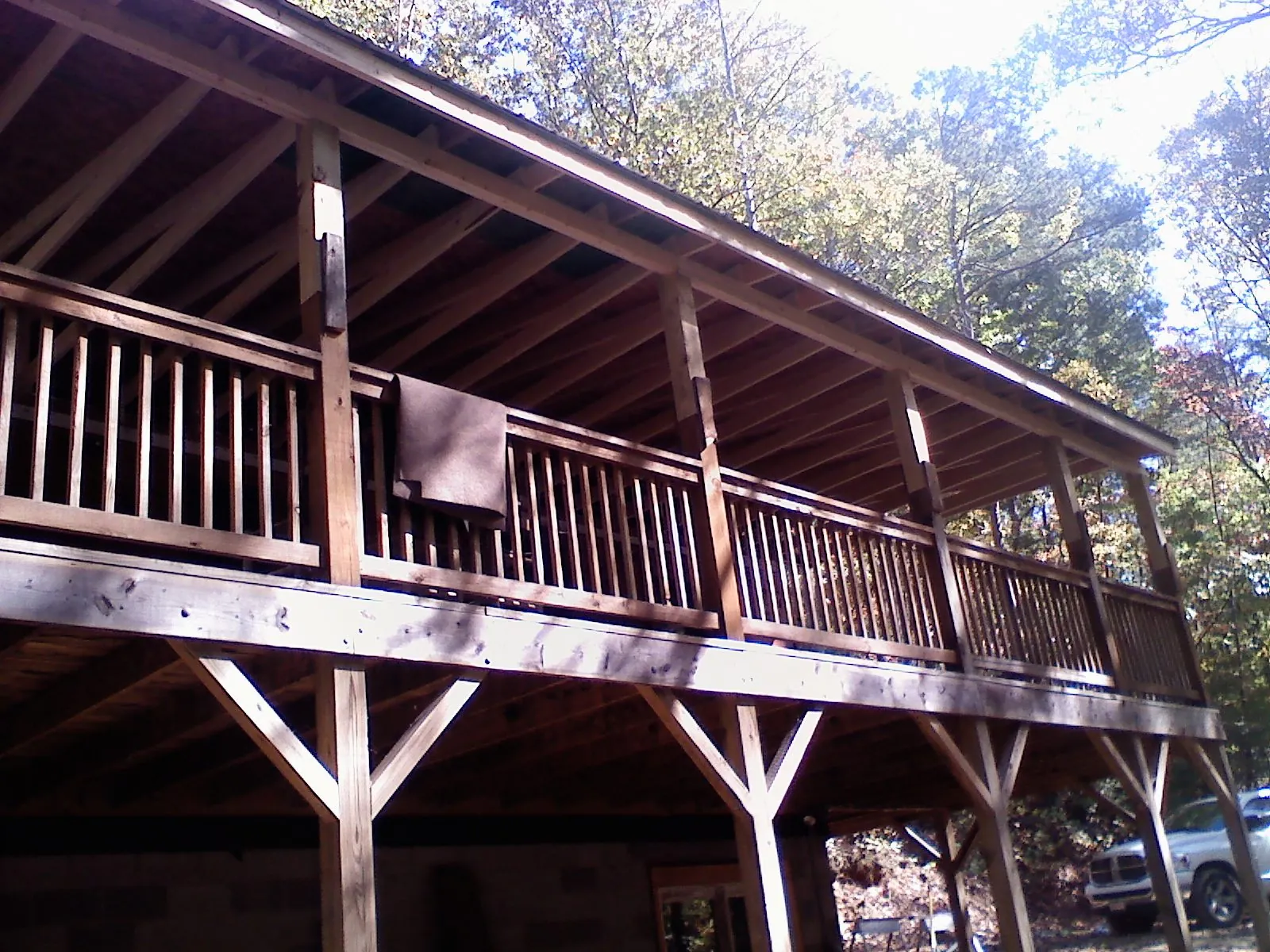 Timber framing under a new elevated porch and deck in Newbury